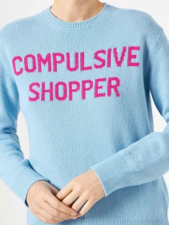 Maglia da donna girocollo di colore azzurro con stampa Compulsive Shopper